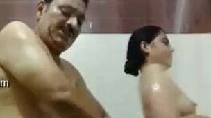 Indian old guy having romance in shower